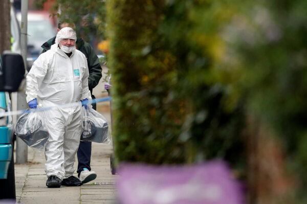 A member of forensic police looks on as he walks, following the car blast of Liverpool Women's Hospital, in Liverpool, Britain, on Nov. 15, 2021. (Ed Sykes/Reuters)