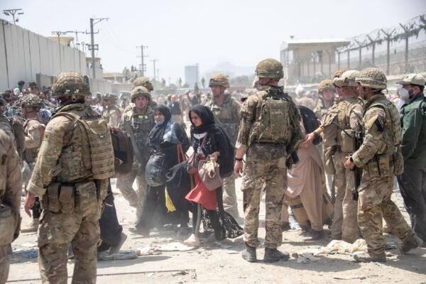 British armed forces work with the U.S. military to evacuate eligible civilians and their families out of the country in Kabul, Afghanistan on Aug. 21, 2021. (British Ministry of Defense Crown Copyright via Getty Images)