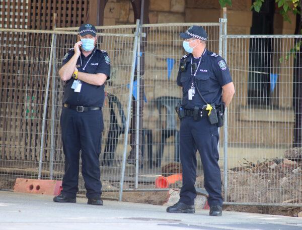 Police officers at M Suites in North Adelaide, Australia, on Jan. 28, 2021. Tennis players and support are currently in 14 days of quarantine after arriving in Melbourne on International flights, ahead of the 2021 Australian Open and lead-in events. (Photo by Kelly Barnes/Getty Images)