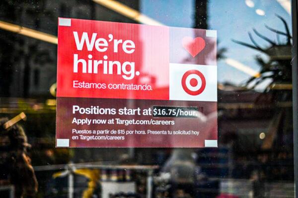A sign advertising for new employees with an updated starting salary of $16.75 per hour is seen in the window of a Target store in Hollywood, Calif., on Nov. 9, 2021. (ROBYN BECK/AFP via Getty Images)