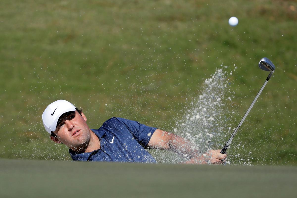 Scottie Scheffler hits out of a bunker on the second hole during the final round of the Houston Open golf tournament in Houston, on Nov. 14, 2021. (Michael Wyke/AP Photo)