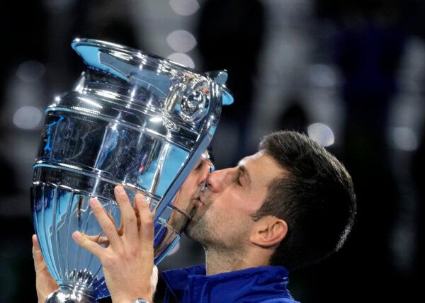 Serbia's Novak Djokovic kisses the trophy as ATP world best player, at the Tennis ATP World Tour Finals, at the Pala Alpitour in Turin, Italy, on Nov. 15, 2021. (Luca Bruno/AP Photo)