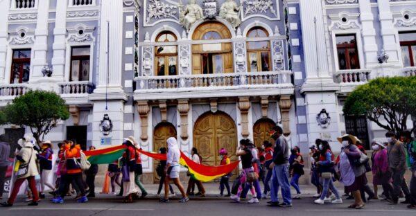 Demonstrators march in front of the government building in Sucre, Bolivia, on Nov. 12, 2021. (Autumn Spredemann/The Epoch Times)