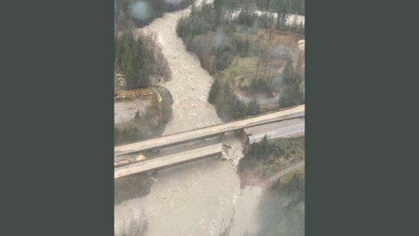 An aerial view shows a washed-out bridge on the Coquihalla Highway as a flood sweeps through, near Carolin Mine Road, British Columbia, Canada, on Nov. 15, 2021. (B.C. Ministry of Transportation and Infrastructure/Handout via /Reuters)