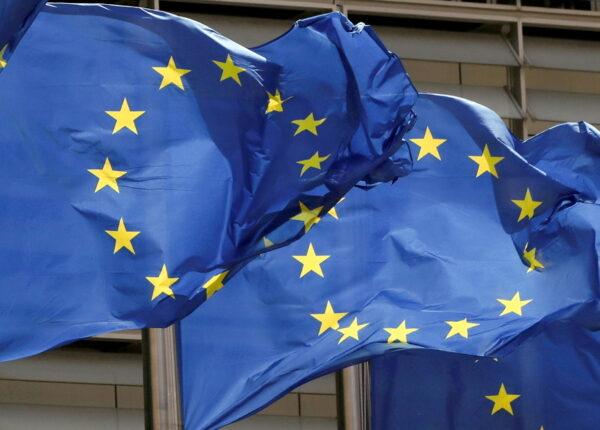European Union flags flutter outside the EU Commission headquarters in Brussels, Belgium, on May 5, 2021. (Yves Herman/Reuters)