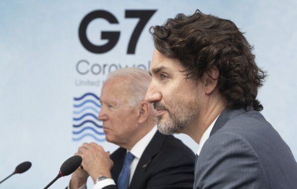 Prime Minister Justin Trudeau and U.S. President Joe Biden listen to opening remarks during a plenary session at the G-7 Summit in Carbis Bay, United Kingdom, on June 11, 2021. (The Canadian Press/Adrian Wyld)