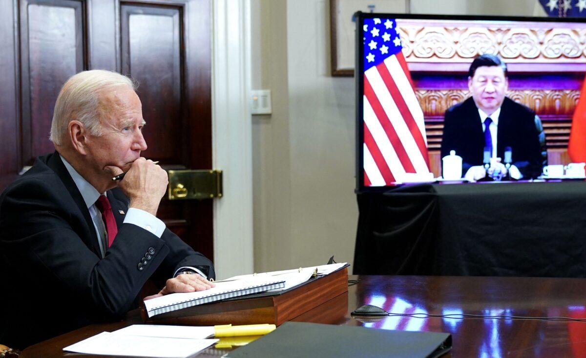 U.S. President Joe Biden meets with Chinese leader Xi Jinping during a virtual summit from the Roosevelt Room of the White House on Nov. 15, 2021. (Mandel Ngan/AFP via Getty Images)