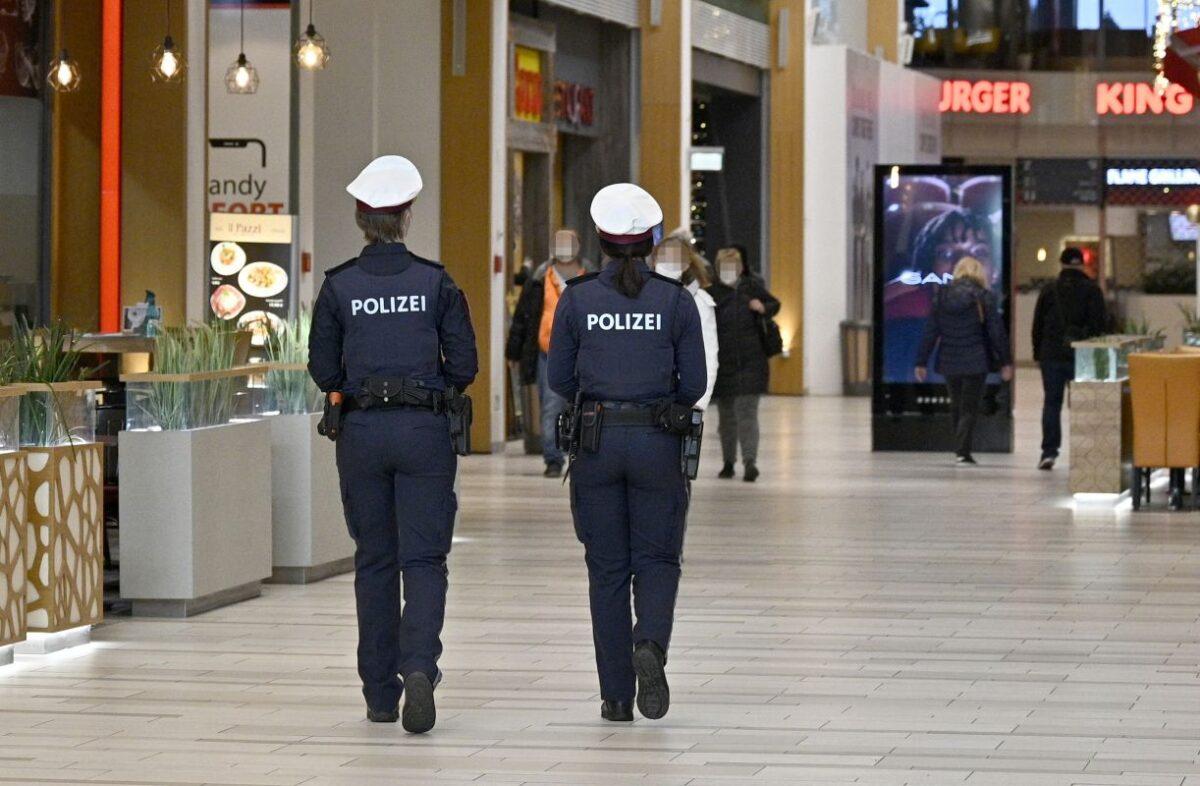 Austrian police officers patrol a shopping mall in Voesendorf, district Moedling, Austria, on Nov. 16, 2021. (Hans Punz/APA/AFP via Getty Images)