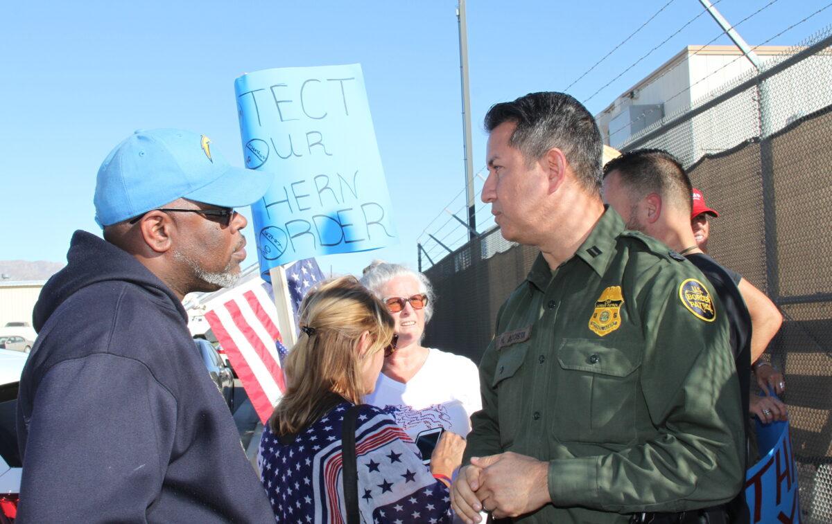 Border Patrol supervisor Hector Acosta speaks with San Jacinto City Councilman Brian Hawkins in Indio, Calif., on Nov. 11, 2021. (Brad Jones/The Epoch Times)