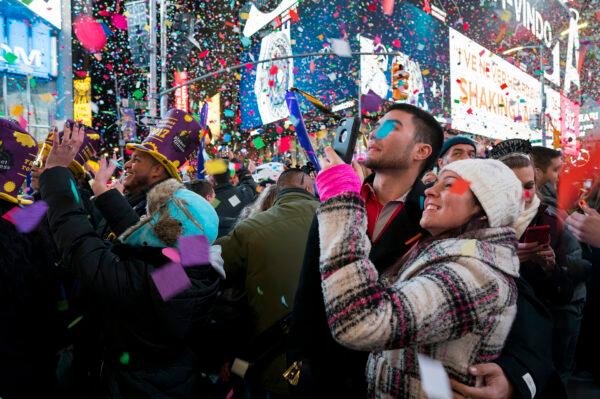 Confetti falls as people celebrate the new year in New York's Times Square, on Jan. 1, 2017. (Craig Ruttle/AP Photo)