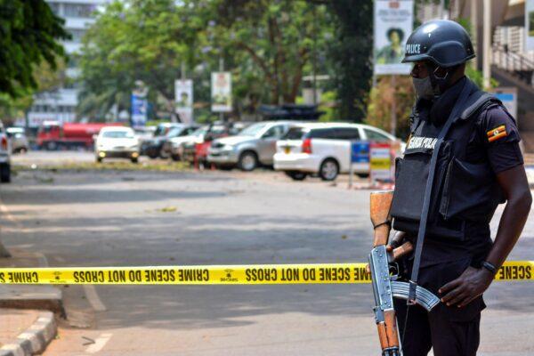 Security forces secure the scene of a blast on a street near the parliamentary building in Kampala, Uganda on Nov. 16, 2021. (Hajarah Nalwadda)