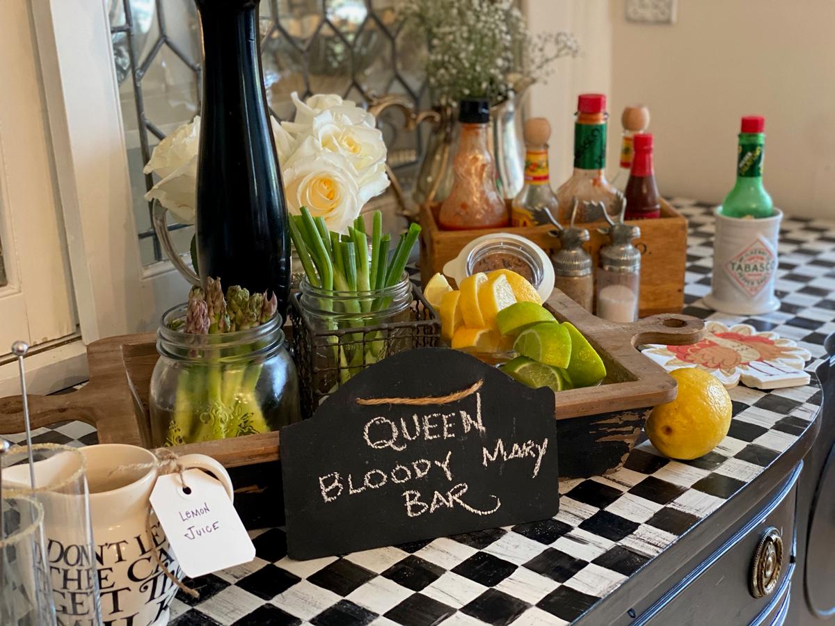 PK presides over all things drinks, including the bloody mary bar—complete with homemade hot sauce, beef consomme, and over-the-top garnishes. (Courtesy of the Isacs family)