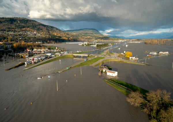 Floodwaters cover Highway 1 in Abbotsford, B.C., on Nov. 16, 2021. (The Canadian Press/Jonathan Hayward)