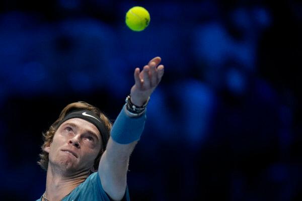 Russia's Andrey Rublev serves a ball to Serbia's Novak Djokovic during their ATP World Tour Finals singles tennis match, at the Pala Alpitour in Turin, Italy, on Nov. 17, 2021. (Luca Bruno/AP Photo)