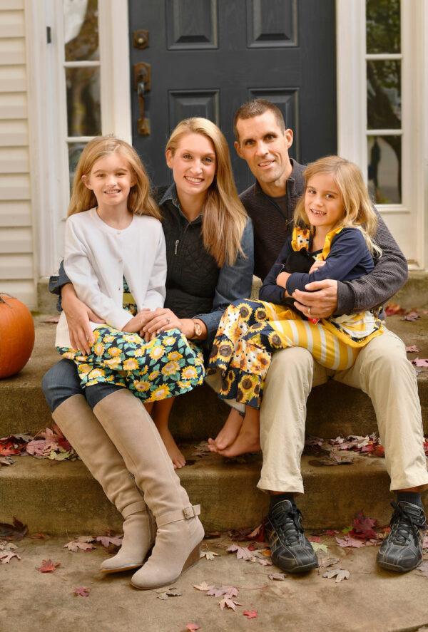 Amelia and Troy Stansell of Warrenton, Va., pose on their front stoop with their 9-year-old daughter Amelia Grace (L) and 7-year-old daughter Betsy Ann (Bitsy) (R). Troy and Amelia wrote out a family mission plan for how they wanted to help their daughters grow, mature, and live with the faith and values that they feel are important. (Randy Litzinger)