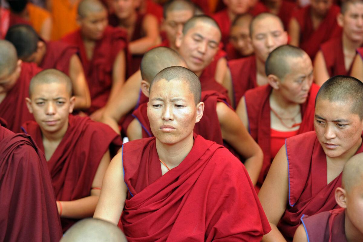 Tibetan Buddhist monks and nuns participate in a sit-in solidarity rally against the Chinese Communist Party's rule on Tibet, in the Indian capital city of New Delhi on Oct. 18, 2011. (Raveendran/AFP via Getty Images)