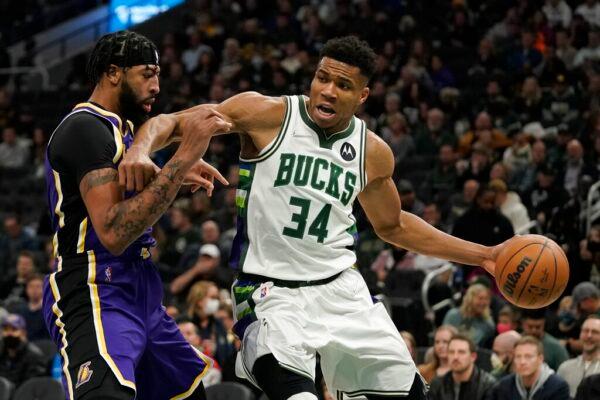Milwaukee Bucks' Giannis Antetokounmpo tries to get past Los Angeles Lakers' Anthony Davis during the second half of an NBA basketball game in Milwaukee on Nov. 17, 2021. (Morry Gash/AP Photo)