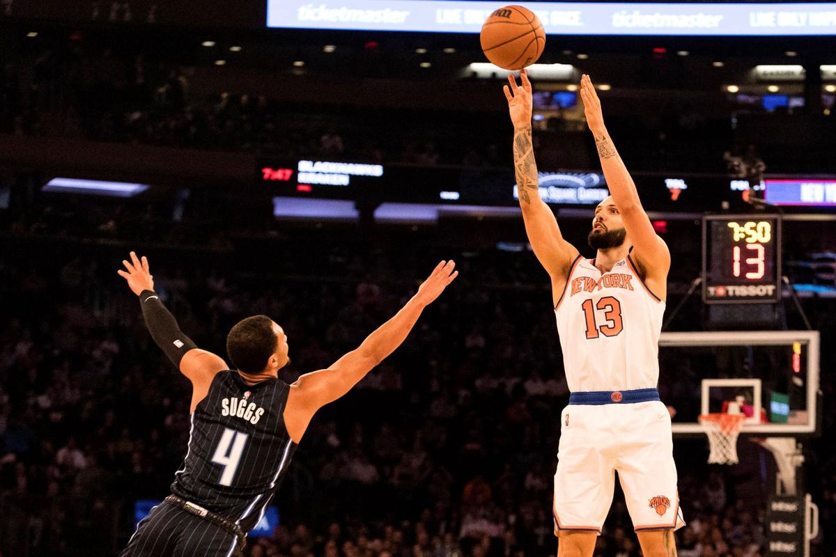New York Knicks guard Evan Fournier (13) shoots over Orlando Magic guard Jalen Suggs (4) during the first half of an NBA basketball game in New York, on Nov. 17, 2021. (Jessie Alcheh/AP Photo)