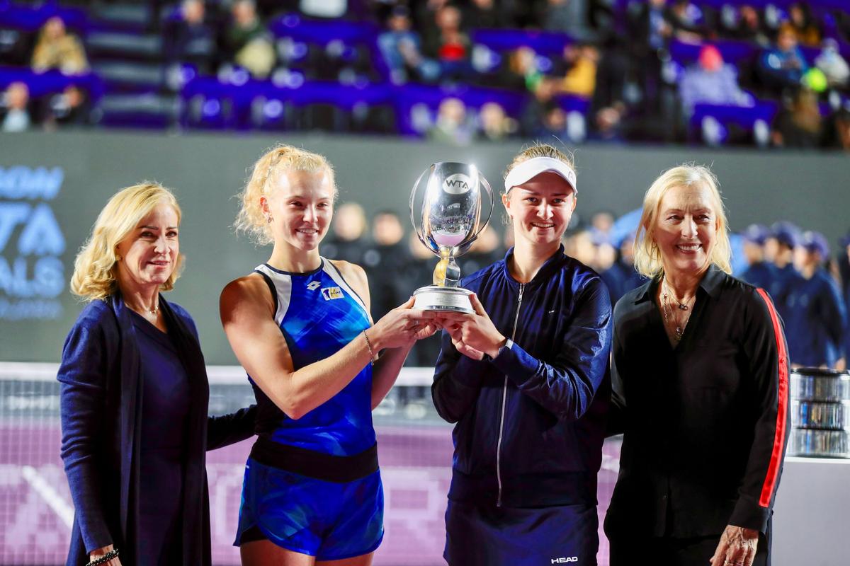Barbora Krejcikova, second from right, and Katerina Siniakova, second from left, of the Czech Republic, hold their trophy accompanied by former players Martina Navratilova, (R), and Chris Evert during an awarding ceremony after win the doubles final match of the WTA Finals tennis tournament in Guadalajara, Mexico, on Nov. 17, 2021. (Refugio Ruiz/AP Photo)
