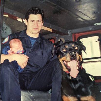 Scott Troogstad sits in his fire engine with his newborn son in 2000, shortly after he was assigned to Engine Company 99 of Chicago Fire Department on the southwest side of Chicago. (Courtesy of Scott Troogstad)