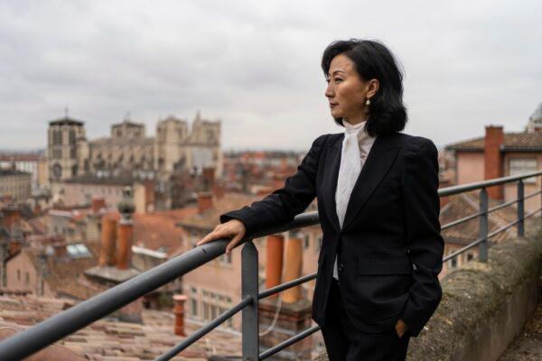 Grace Meng, the wife of former Interpol president Meng Hongwei, poses for a photo after an interview with the Associated Press in Lyon, central France, on Nov. 16, 2021. (Laurent Cipriani/AP Photo)