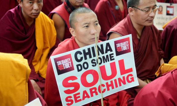  Tibetan Buddhist monks and nuns attend a sit-in solidarity rally against the Chinese Communist Party’s rule of Tibet, in the Indian capital city of New Delhi on Feb. 2, 2013. (Raveendran/AFP via Getty Images)