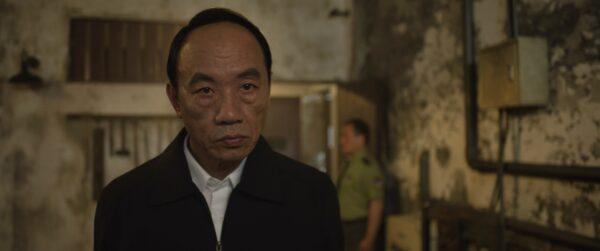 CCP Secretary Yang (Tzu-Chiang Wang) supervises the interrogation of a Falun Gong practitioner. (Flying Cloud Productions)