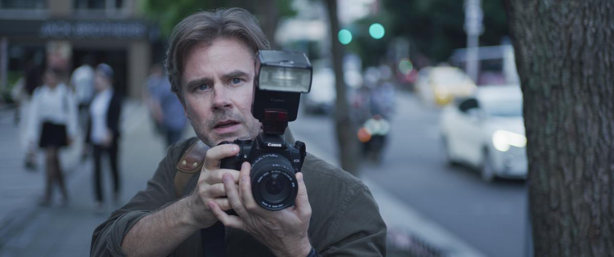  Daniel Davis (Sam Trammell), an intrepid newspaper journalist stationed in China, catches wind of the regime’s sudden oppression of Falun Gong, in a scene from "Unsilenced." (Courtesy of Flying Cloud Productions)