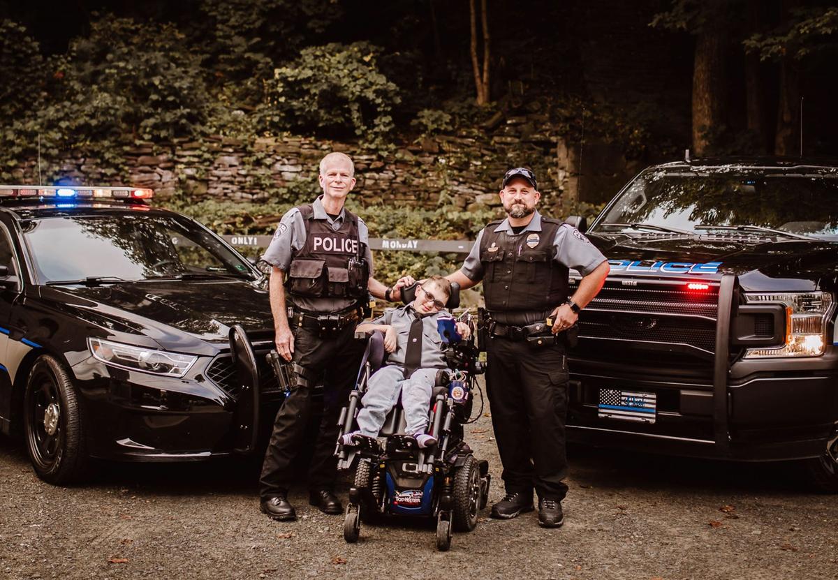 Josh with the Gibson state police officers. (Courtesy of <a href="https://www.facebook.com/rebecca.bourassa.3">Rebecca Bourassa</a>)