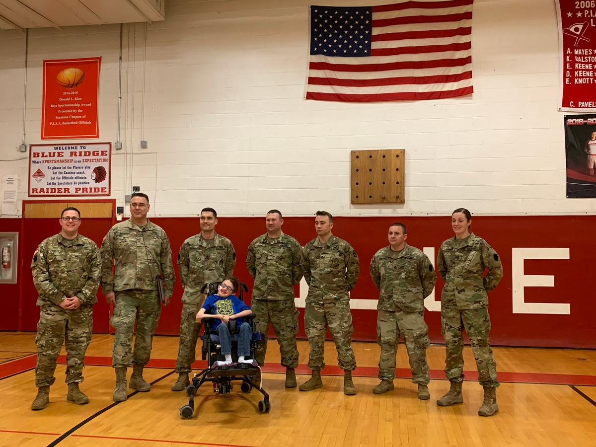 Josh with the Army officers from the 1st battalion 109th infantry Men of Iron in April 2019 during an event at his school. They honored him as "Sergeant" Josh Bourassa. (Courtesy of <a href="https://www.facebook.com/rebecca.bourassa.3">Rebecca Bourassa</a>)