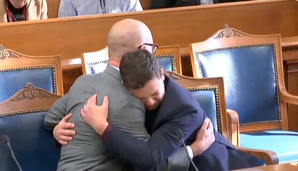 Kyle Rittenhouse (R) hugs his lawyer after he is found not guilty on all counts at the county courthouse in Kenosha, Wis., in a still from video taken on Nov. 19, 2021. (CBS, Reuters/Screenshot via NTD)