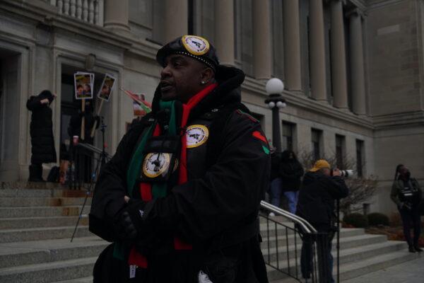 Royal Black Panther Party Chicago commander Cleveland Barrett stands outside the Kenosha County Courthouse in Kenosha Wisconsin on Nov. 18. (Jackson Elliott/The Epoch Times)
