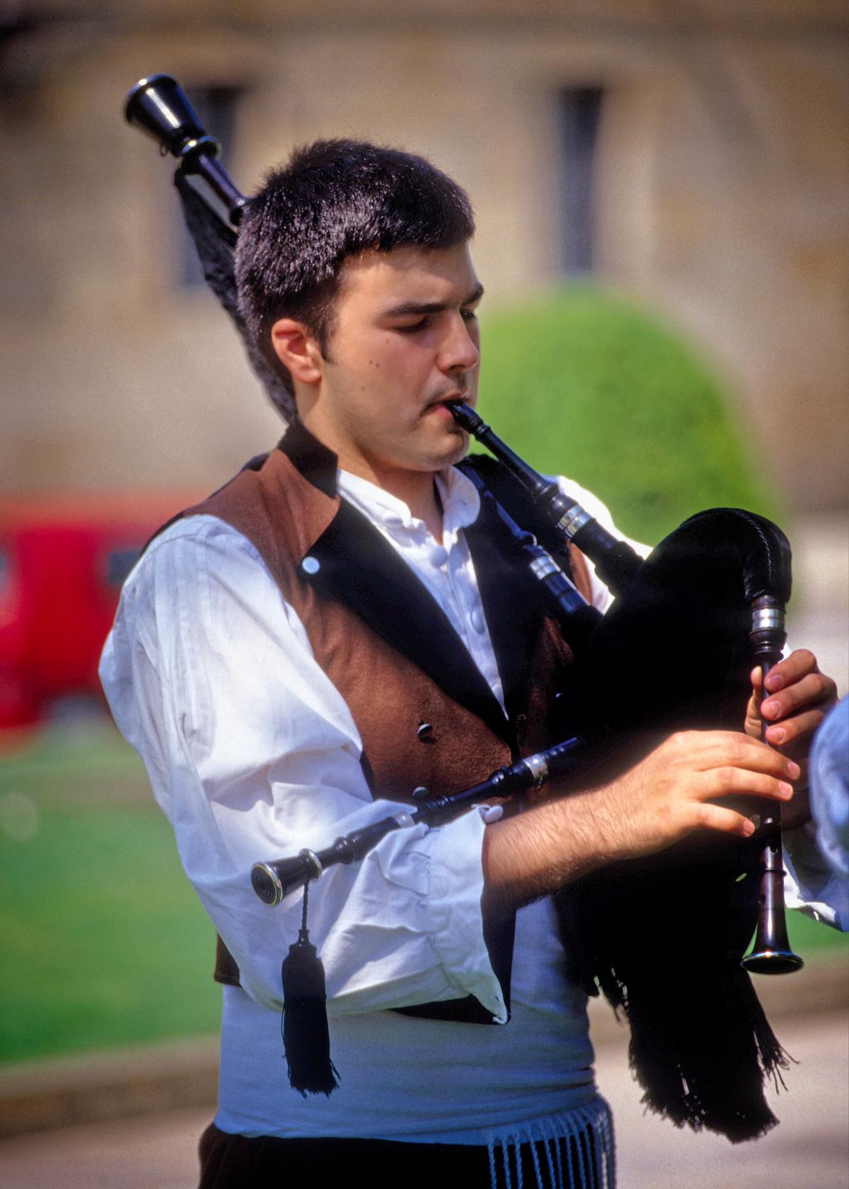 A young musician performs at a Galician festival. (Copyright Fred J. Eckert)