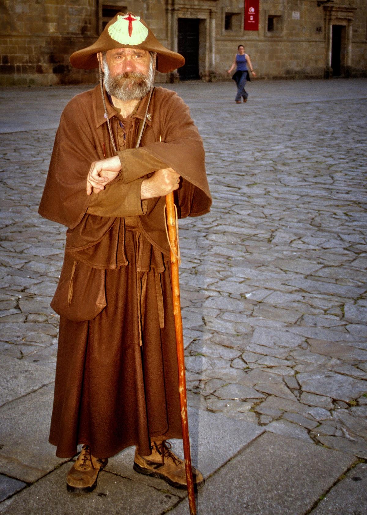 A man dressed as one of the pilgrims who used to trek across Europe along the “Way of St. James” destined for Santiago de Compostela. (Copyright Fred J. Eckert)