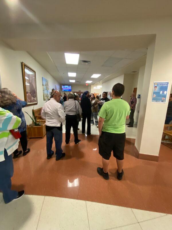 The overflow crowd waits outside the room at a Flagler County School Board meeting in Bunnell, Fla., on Nov. 16, 2021. (Patricia Tolson/The Epoch Times)