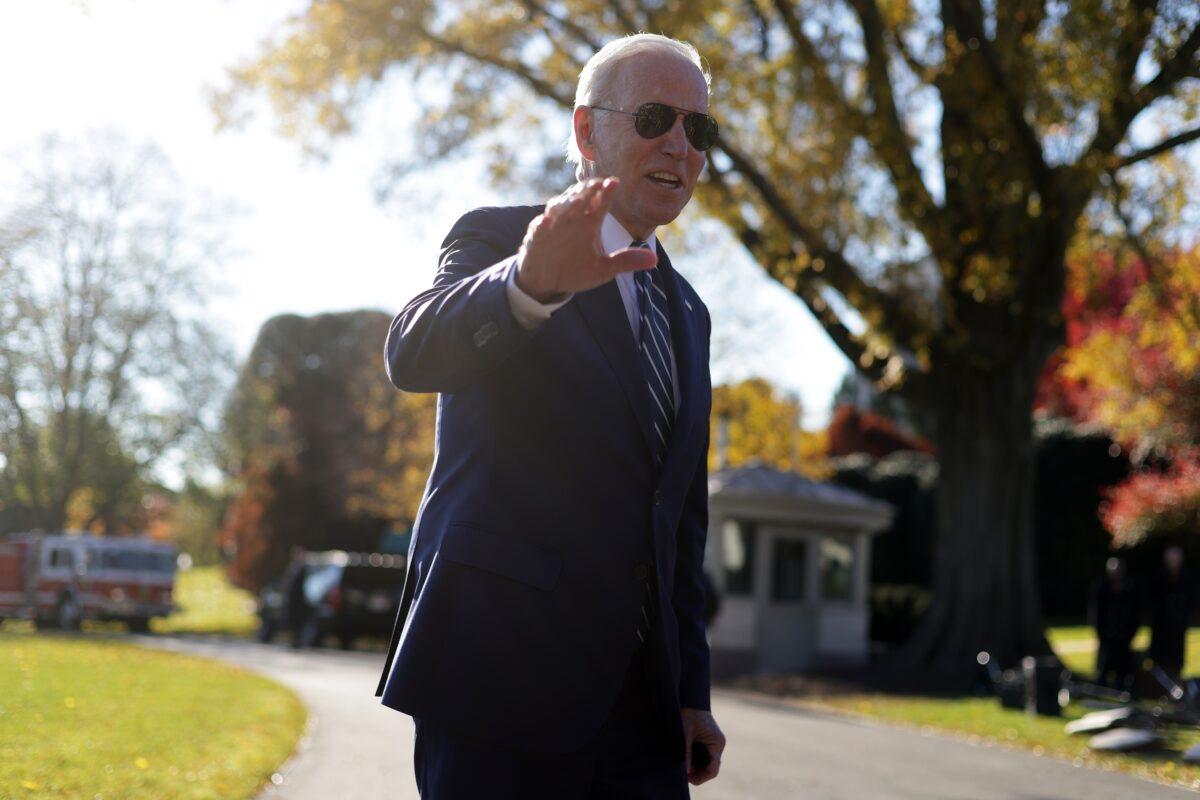 President Joe Biden waves to members of the press after returning to the White House in Washington on Nov. 19, 2021. (Alex Wong/Getty Images)