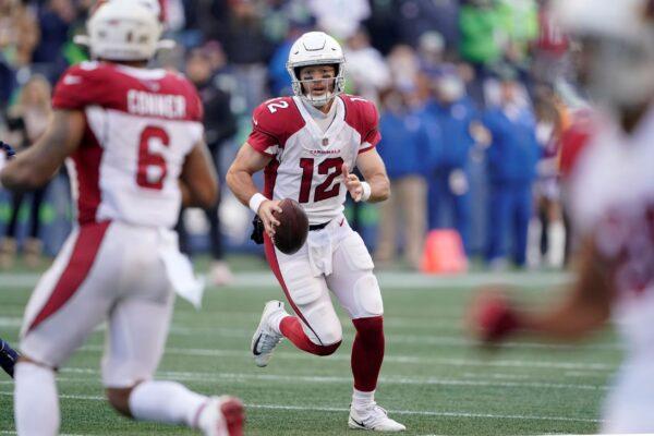 Arizona Cardinals quarterback Colt McCoy scrambles against the Seattle Seahawks during the first half of an NFL football game in Seattle, on Nov. 21, 2021. (Ted S. Warren/AP Photo)