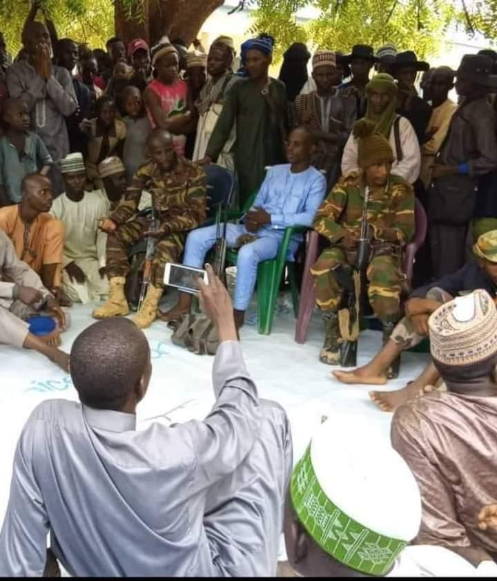 Bandit gang leader Bello Turji (first from left seated) at a peace meeting with government officials in Isa Local Government, which borders Sabon Birni county in the east of Sokoto in February 2019. (Mansur Isa Buhari)