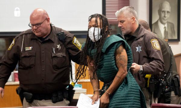 Darrell Brooks is escorted out of the courtroom after making his initial appearance in Waukesha County Court in Waukesha, Wis., on Nov. 23, 2021. (Mark Hoffman/Milwaukee Journal-Sentinel via AP, Pool)