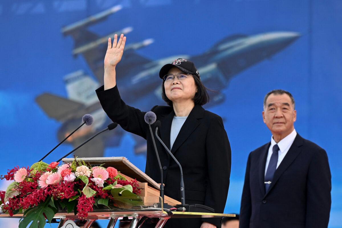 Taiwan President Tsai Ing-wen (L) waves at an upgraded U.S.-made F-16 V fighter as Defense Minister Chiu Kuo-cheng looks on during a ceremony at the Chiayi Air Force in southern Taiwan on Nov. 18, 2021. (Sam Yeh/AFP via Getty Images)