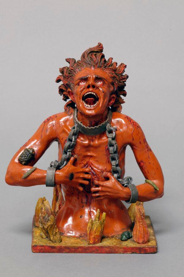 "Soul in Hell," part of "The Four Fates of Man," circa 1775, attributed to Manuel Chili, known as Caspicara. Polychromed wood, glass, and metal; 7 inches by 5 3/4 inches by 3 1/8 inches. (The Hispanic Society Museum & Library)