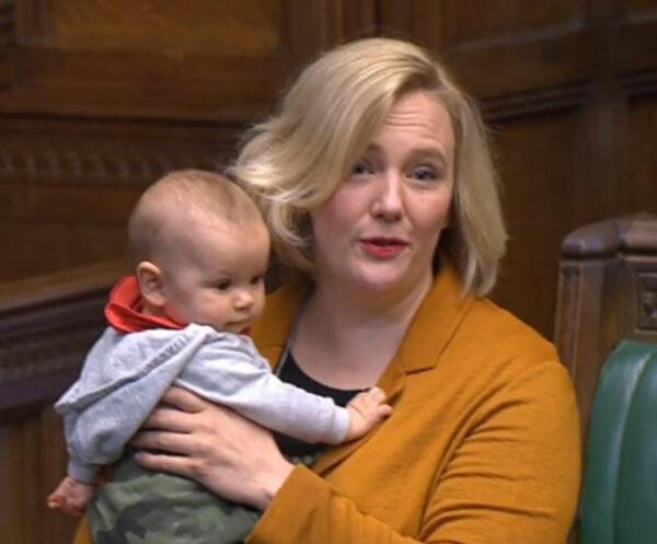Labour MP Stella Creasy holds her baby daughter, Hettie, in the House of Commons in London as she contributes to a debate on June 4, 2020. (House of Commons/PA)