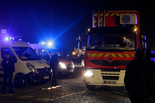 A rescue workers truck leaves the port of Calais, northern France, on Nov. 24, 2021. (Michel Spingler/AP Photo)