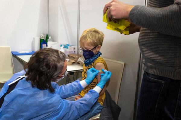 A boy receives his first shot of the COVID-19 vaccine in Vienna, Austria, on Nov. 15, 2021. (Joe Klamar/AFP via Getty Images)