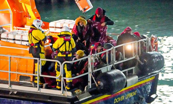 A group of people thought to be illegal immigrants are brought in to Dover, Kent, by the Royal National Lifeboat Institution on Nov. 25, 2021. (Gareth Fuller/PA)