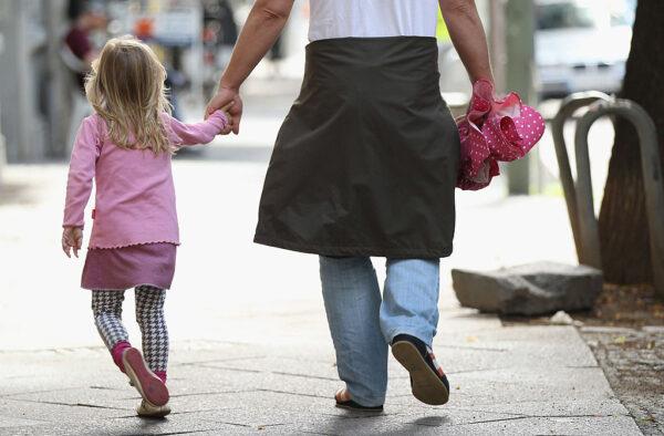 A father and daughter walk in the city centre in Berlin, Germany, on July 17, 2012. (Sean Gallup/Getty Images)