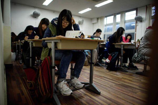 Students sit the annual Scholastic Aptitude Test at the Poongmun high school in Seoul, South Korea, on Nov. 13, 2014. (Ed Jones/AFP via Getty Images)