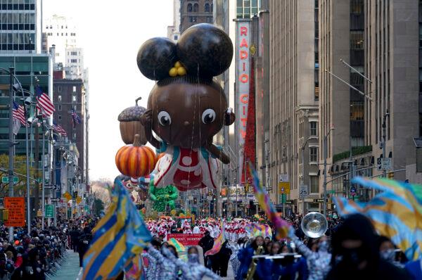 The Ada Twist balloon moves down Sixth Avenue during the Macy's Thanksgiving Day Parade in New York, on Nov. 25, 2021. (Jeenah Moon/AP Photo)