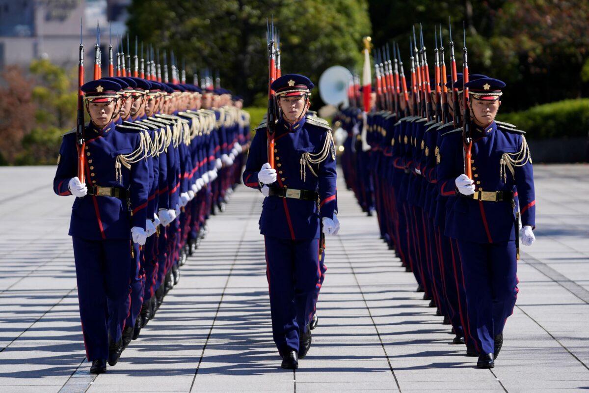 Japan's honor guard marches into the entrance area of the Ministry of Defense in Tokyo, on Nov. 5, 2021. (Hiro Komae/AP Photo)