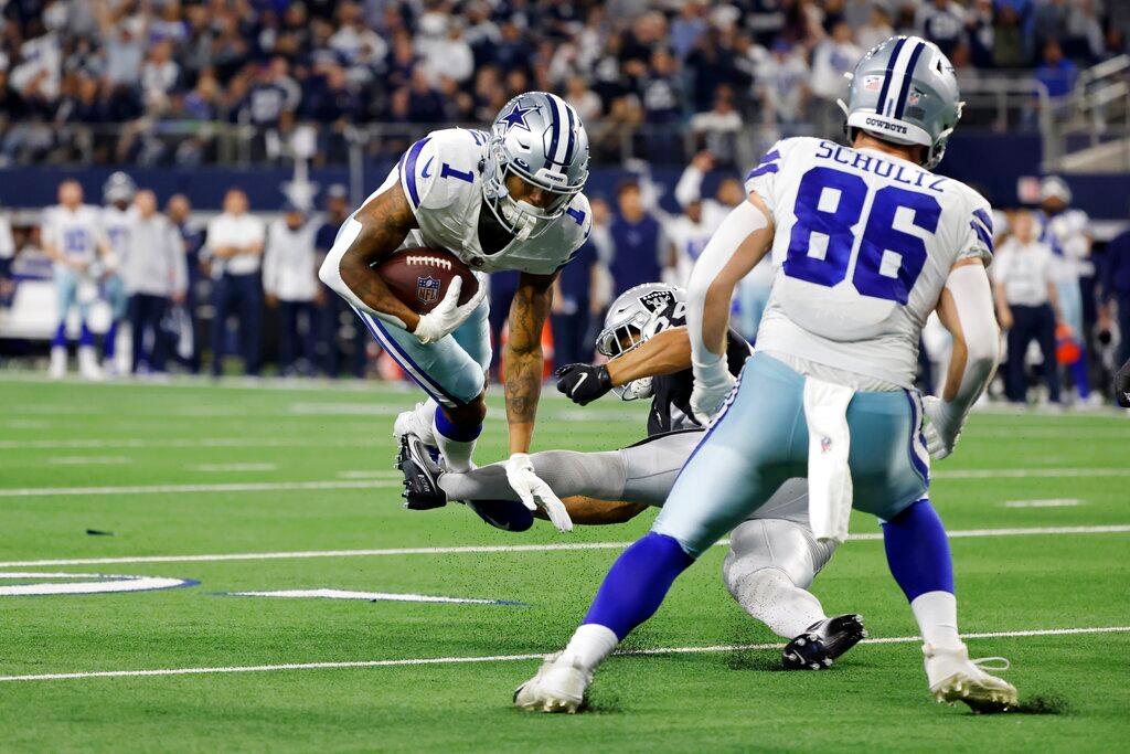 Dallas Cowboys wide receiver Cedrick Wilson (1) is stopped short of scoring on a two-point conversion attempt by Las Vegas Raiders safety Johnathan Abram, as tight end Dalton Schultz (86) looks on in the second half of an NFL football game in Arlington, Texas, on Nov. 25, 2021. (Michael Ainsworth/AP Photo)